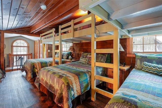 bedroom featuring lofted ceiling, wood ceiling, and wood finished floors