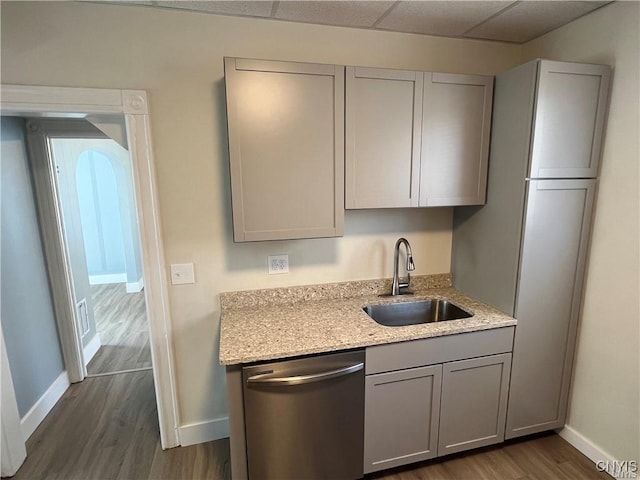 kitchen with gray cabinets, dishwasher, dark hardwood / wood-style floors, and sink