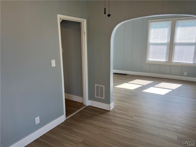 empty room with wood-type flooring