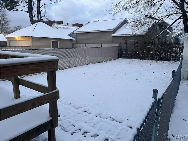 view of yard layered in snow