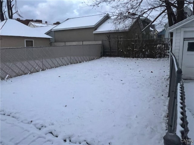 view of yard covered in snow