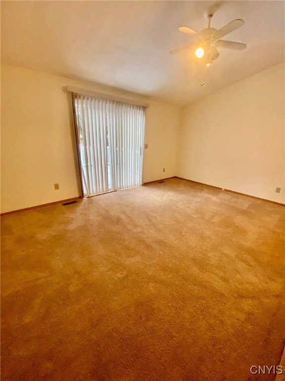 unfurnished room featuring carpet floors and ceiling fan