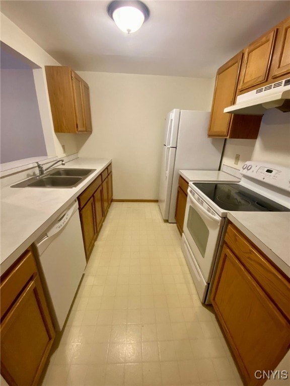 kitchen with white appliances and sink