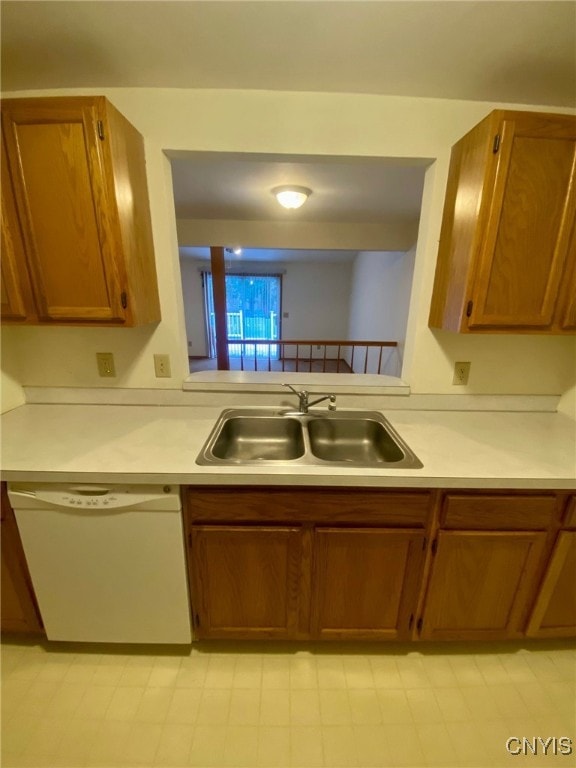 kitchen with white dishwasher and sink