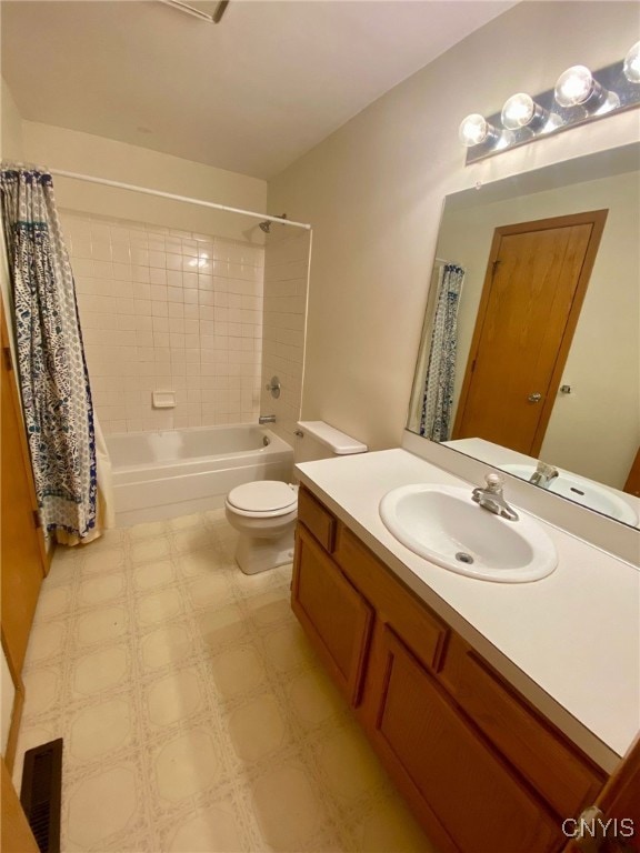 full bathroom featuring vanity, shower / bathtub combination with curtain, and toilet