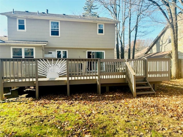 rear view of property featuring a deck