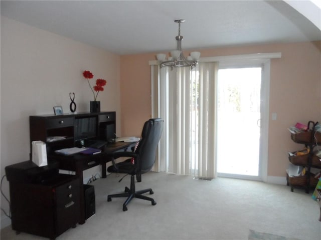 office area featuring carpet flooring and a notable chandelier