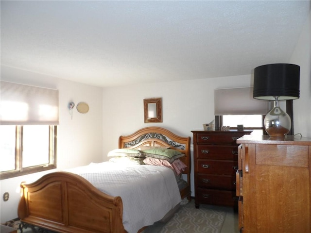 bedroom with light colored carpet