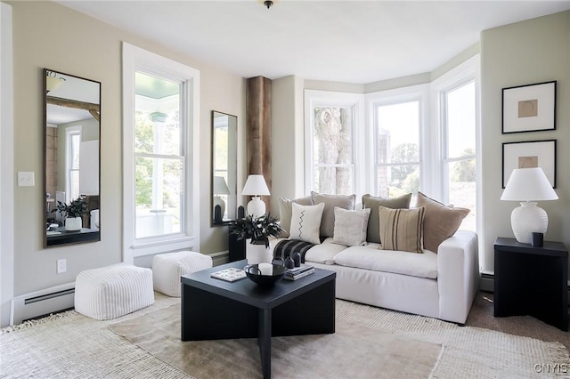 living room with light carpet and a baseboard radiator