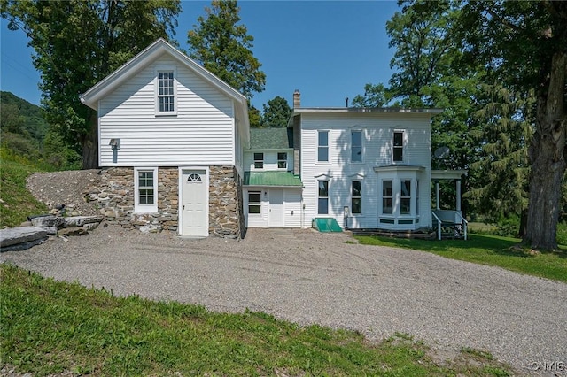 back of house with a yard