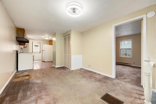 unfurnished living room with light colored carpet and baseboard heating