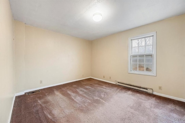 carpeted empty room featuring a baseboard radiator