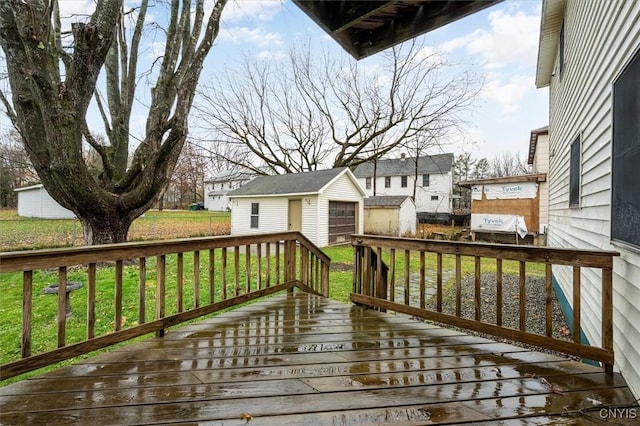 deck with a lawn and an outdoor structure