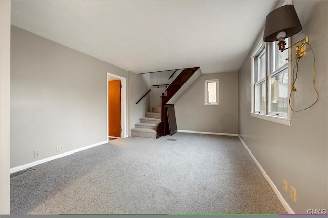 unfurnished living room featuring carpet flooring