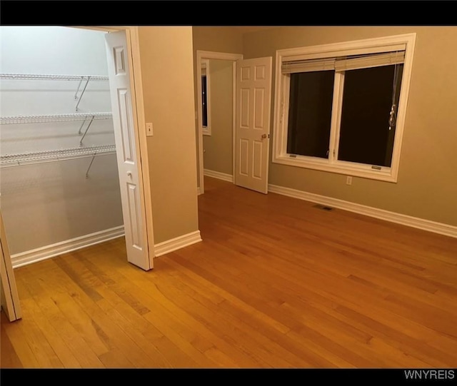 unfurnished bedroom featuring light wood-type flooring