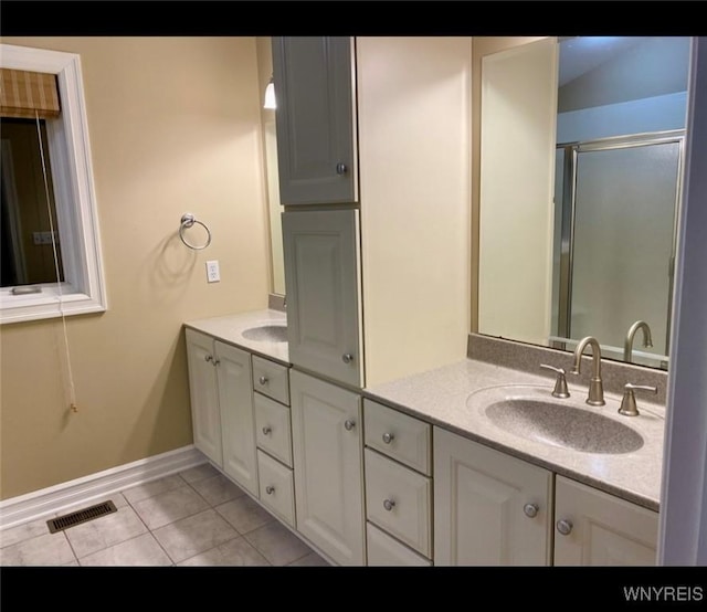 bathroom featuring tile patterned floors and vanity