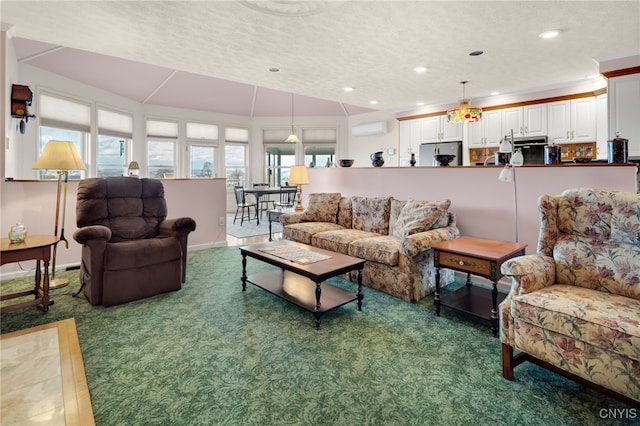 carpeted living room with a textured ceiling, a wall mounted AC, and vaulted ceiling