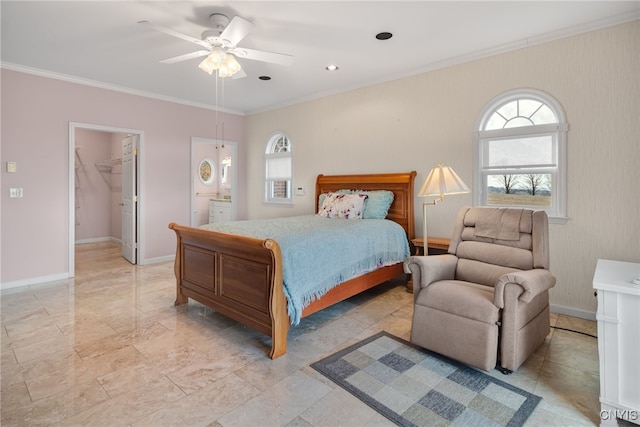 bedroom with a walk in closet, a closet, ceiling fan, and crown molding