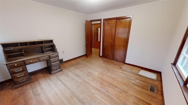 office featuring light wood-type flooring and crown molding