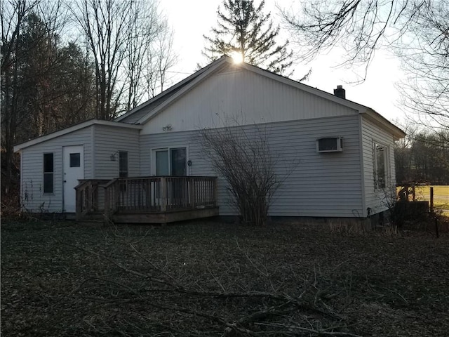 rear view of property with a deck