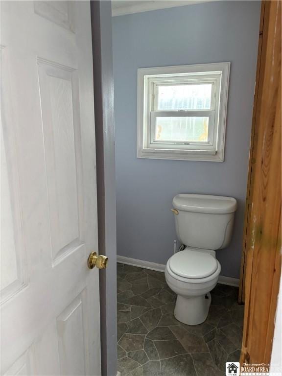 bathroom with tile patterned floors and toilet