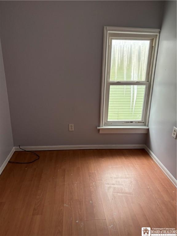 empty room with light hardwood / wood-style floors