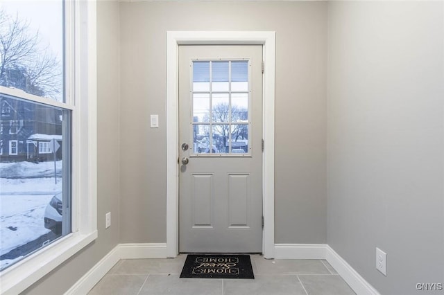 doorway to outside featuring light tile patterned floors