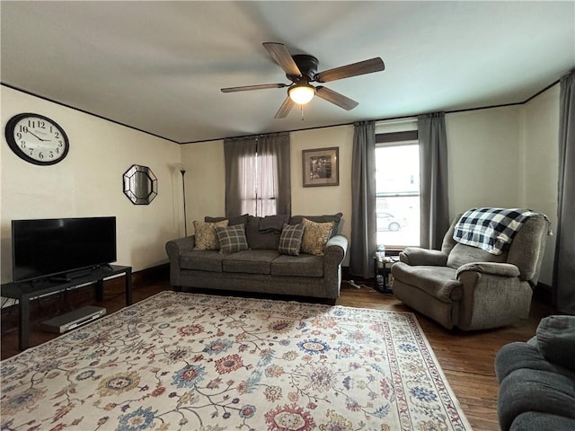 living room featuring ceiling fan and hardwood / wood-style floors