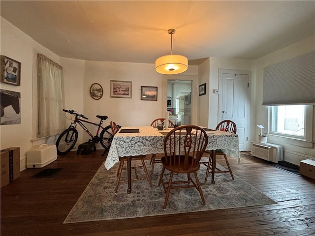 dining space featuring dark hardwood / wood-style floors