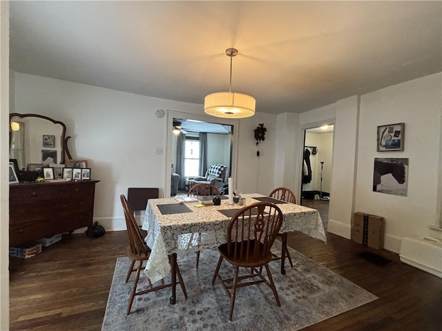 dining space featuring dark hardwood / wood-style floors