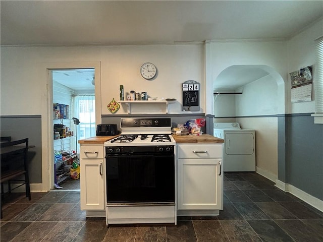 kitchen with white range, white cabinetry, washer / clothes dryer, and wooden counters