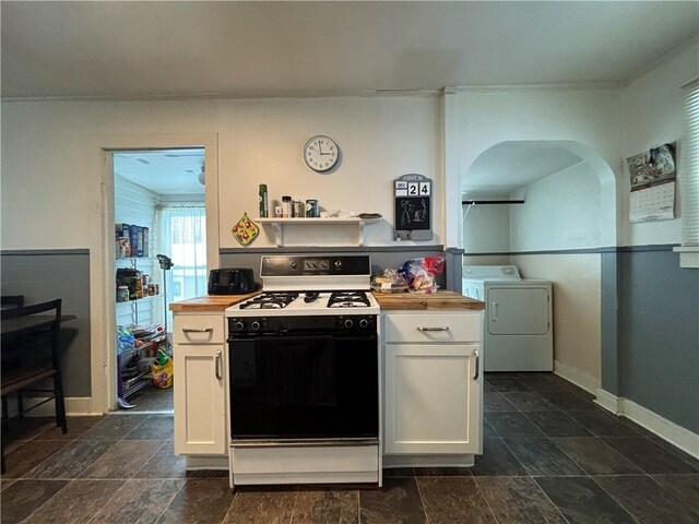 305 Janeway St, Kane Boro, PA 16735 - kitchen with white range with gas stovetop, washer / dryer, butcher block countertops, and white cabinetry