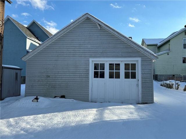 view of snow covered garage