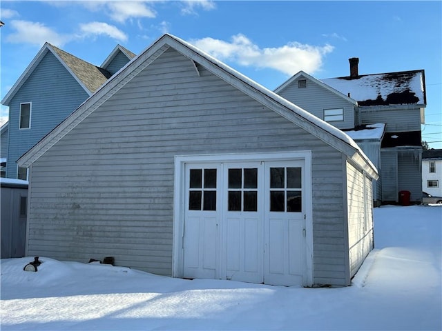 view of snow covered garage