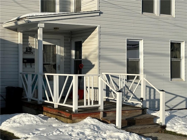 view of snow covered property entrance