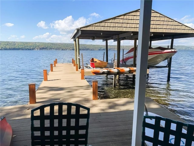 4555 Davies Rd, Hector, NY 14818 - dock featuring boat lift and a water view