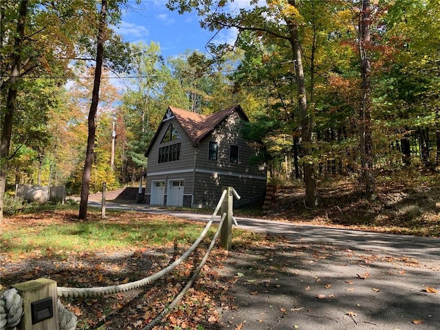 view of property exterior featuring a garage