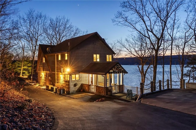 view of front of property with a water view