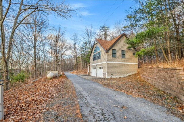 view of side of property featuring a garage