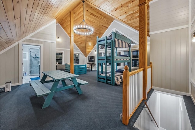 4555 Davies Rd, Hector, NY 14818 - rec room with a chandelier, wooden ceiling, vaulted ceiling, wood walls, and carpet