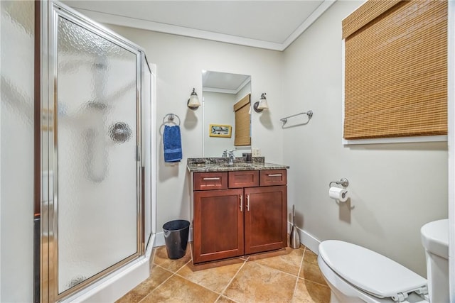 bathroom featuring vanity, toilet, an enclosed shower, and ornamental molding