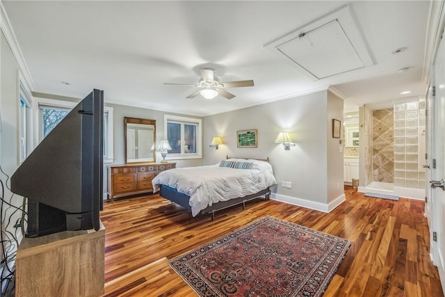 bedroom with connected bathroom, ceiling fan, crown molding, and hardwood / wood-style flooring