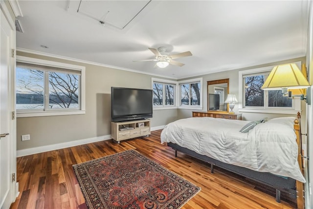 bedroom with ceiling fan, hardwood / wood-style floors, and crown molding