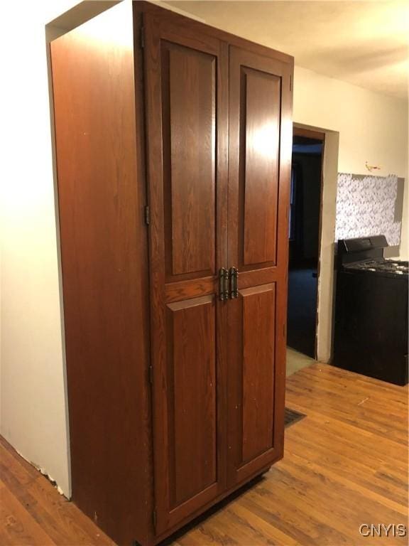 hall with light hardwood / wood-style flooring