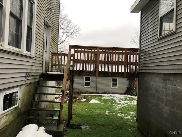 wooden deck with a lawn