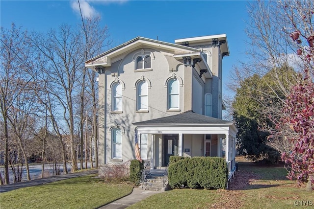 italianate home featuring a front yard