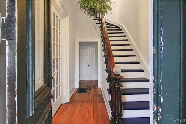 foyer entrance with hardwood / wood-style flooring