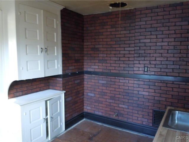 kitchen with brick wall