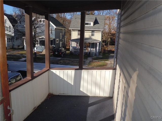 unfurnished sunroom featuring a healthy amount of sunlight