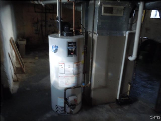 utility room featuring gas water heater